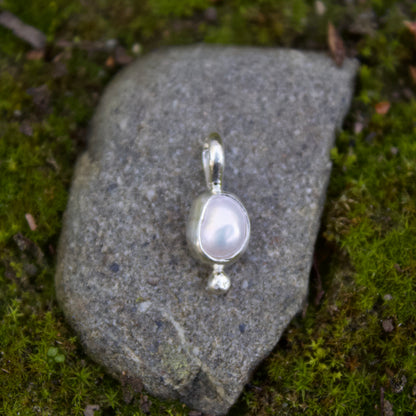 Tiny pearl charm