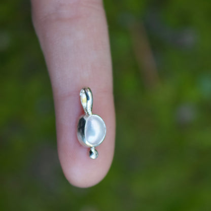 Tiny pearl charm